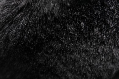 Photo of Texture of dark grey faux fur as background, closeup