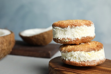 Photo of Sweet delicious ice cream cookie sandwiches on table, space for text