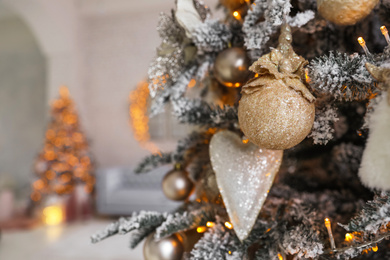 Photo of Beautiful Christmas tree Indoors, closeup. Festive interior decoration