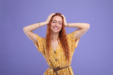 Photo of Beautiful young hippie woman on violet background