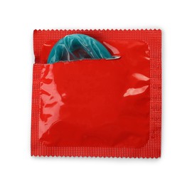 Photo of Condom in torn package isolated on white, top view. Safe sex