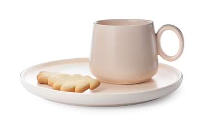 Photo of New clean ceramic cup and cookie on plate against white background