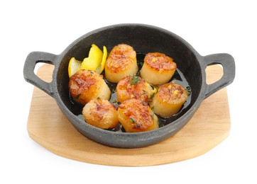 Photo of Delicious fried scallops in pan isolated on white