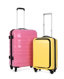 Photo of Stylish suitcases packed for travel on white background. Summer vacation