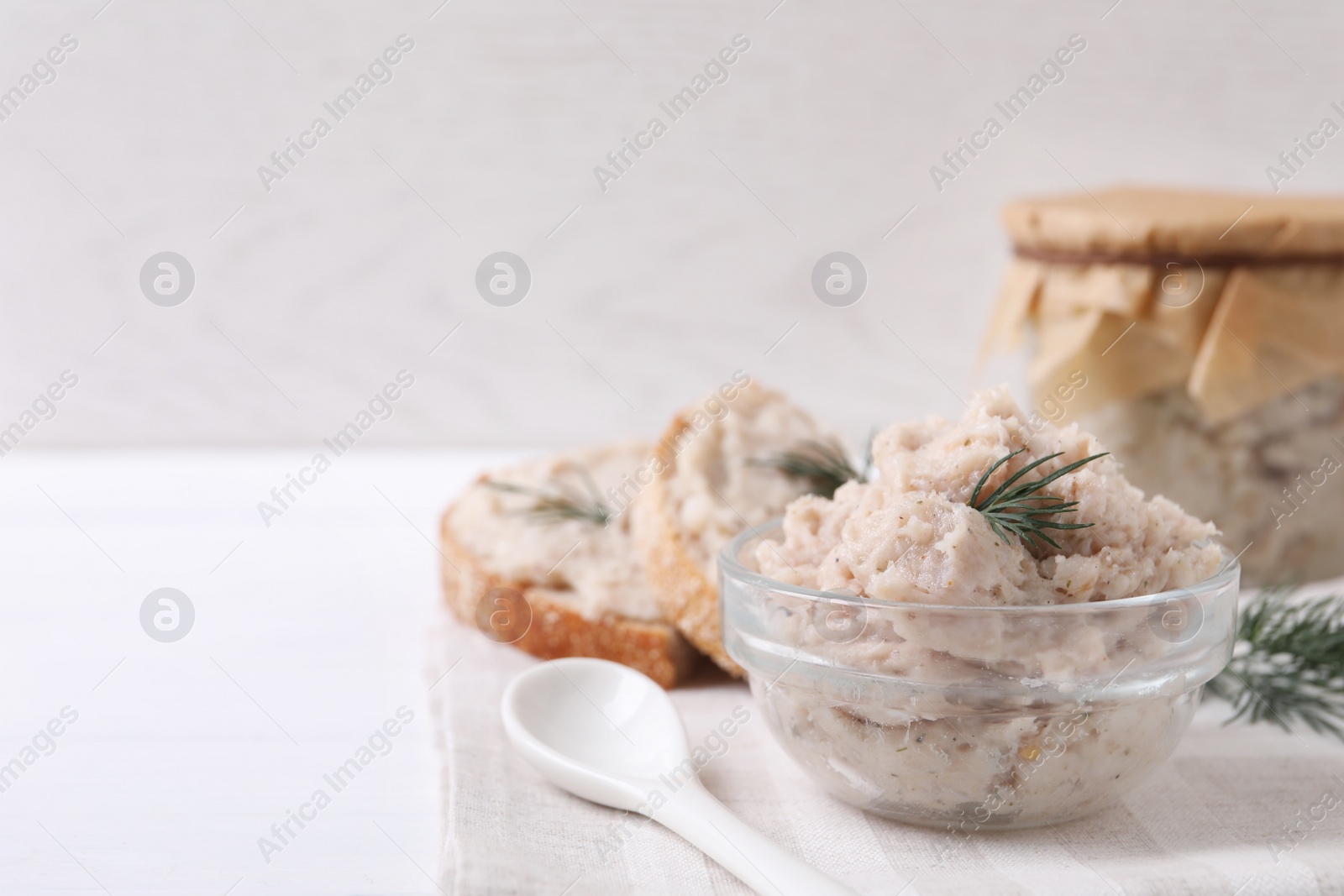 Photo of Delicious lard spread on white table. Space for text