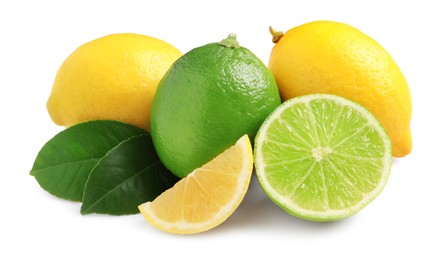 Photo of Fresh ripe lemons, limes and green leaves on white background