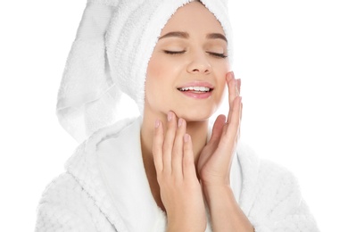 Portrait of young pretty woman in bathrobe with towel on white background