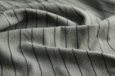 Photo of Texture of grey striped fabric as background, closeup