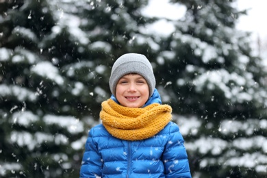 Photo of Portrait of little boy outdoors on snowy day
