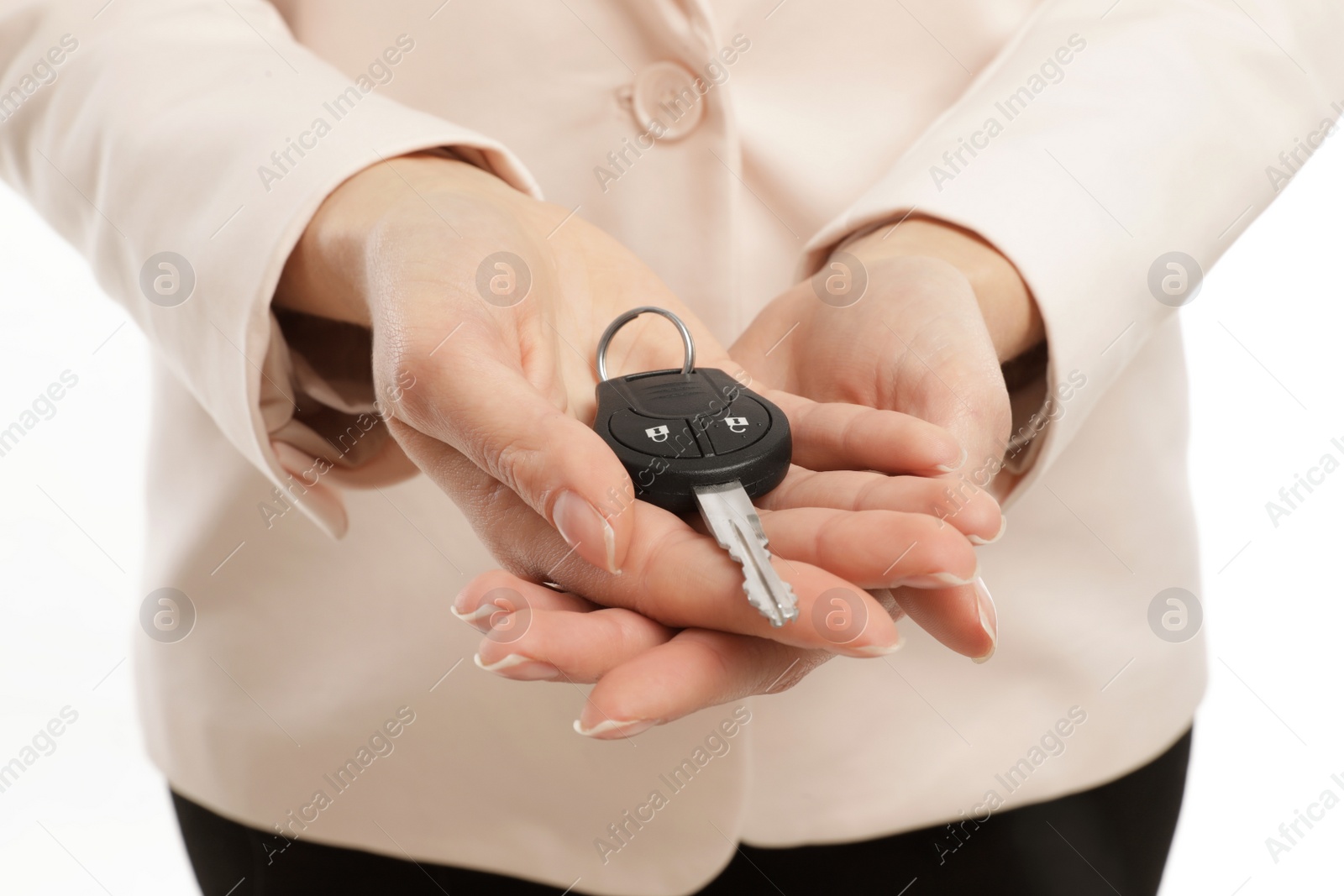 Photo of Woman holding car key isolated on white