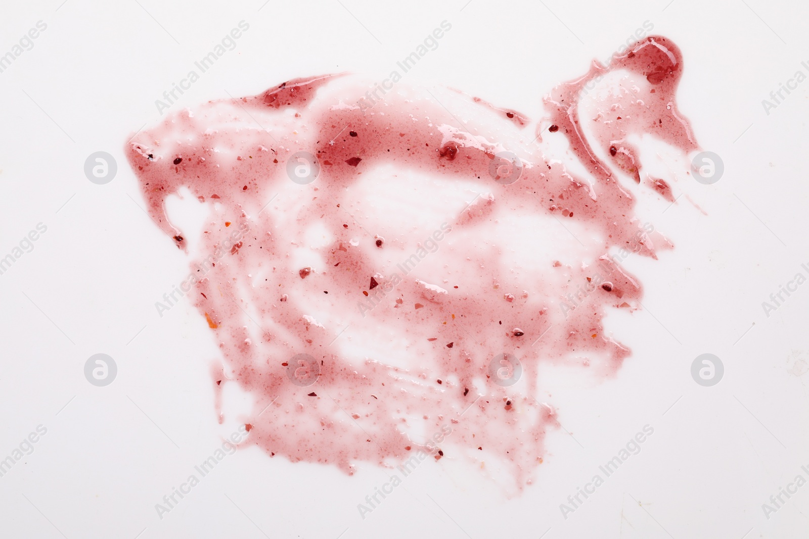 Photo of Smear of sauce on white background, top view