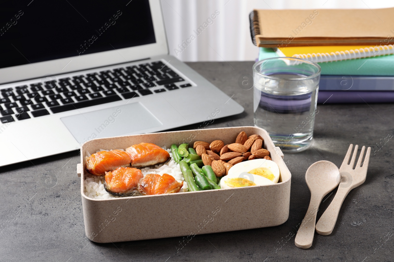 Photo of Container with natural protein food on office table