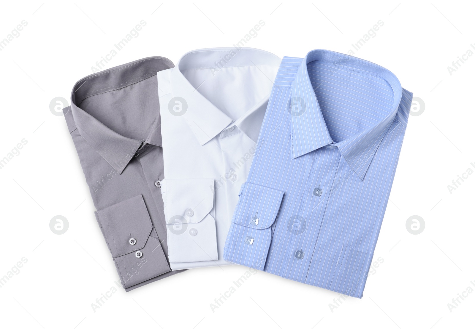 Photo of Stylish shirts isolated on white, top view. Dry-cleaning service