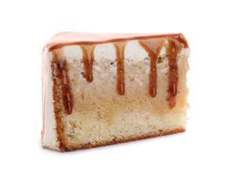 Photo of Slice of delicious cake with caramel sauce isolated on white