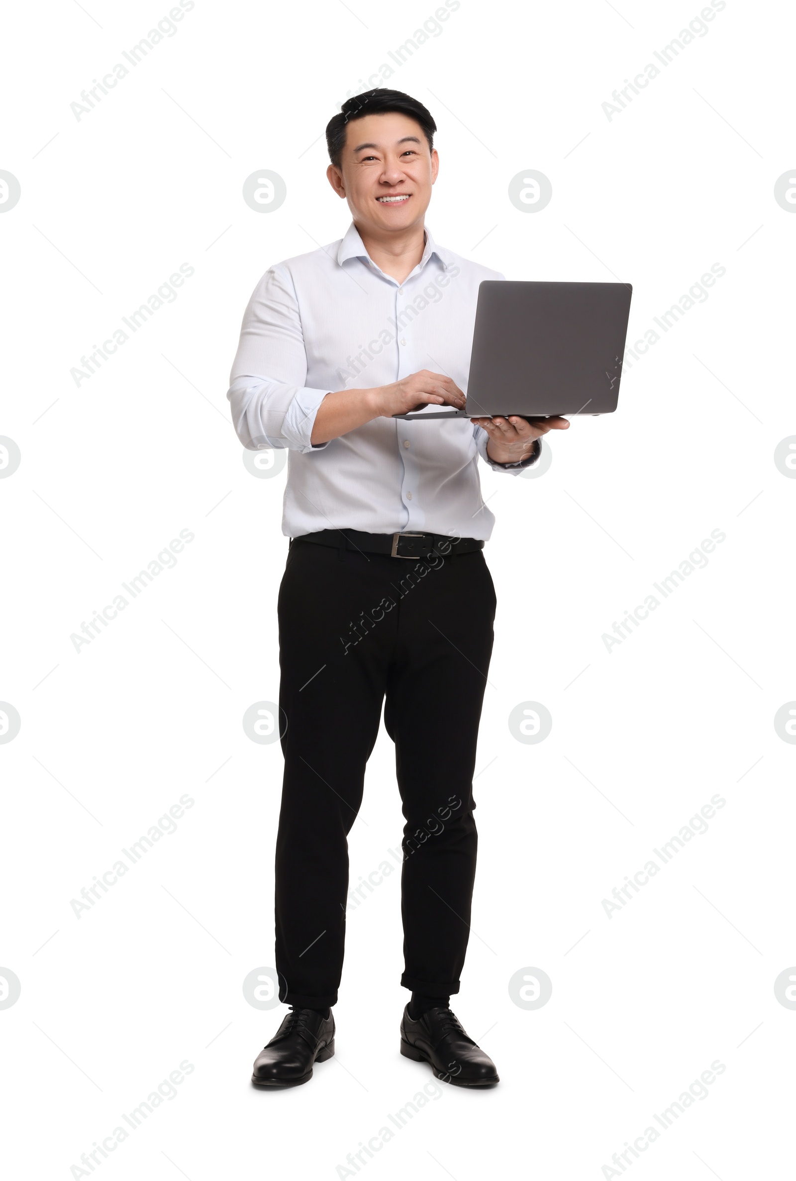 Photo of Businessman in formal clothes working on laptop against white background