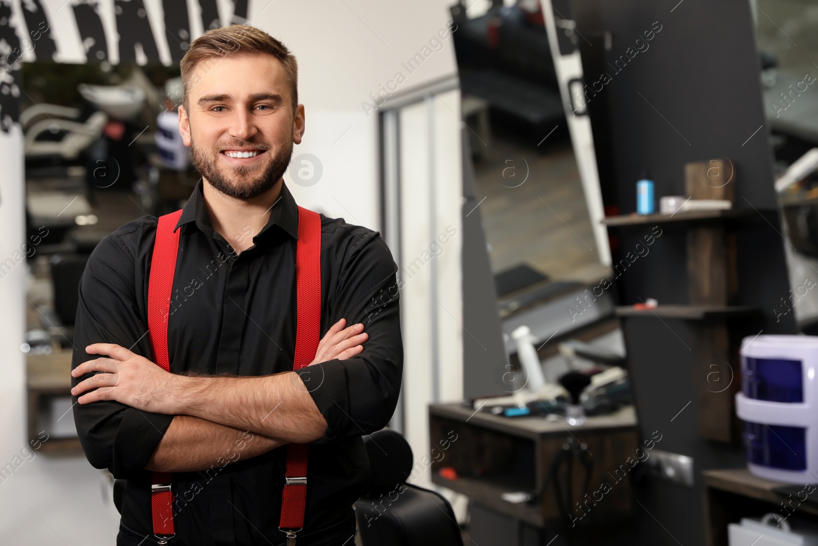 Photo of Young business owner in his barber shop