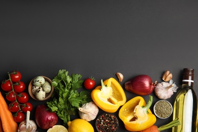 Photo of Flat lay composition with ingredients for cooking on black background. Space for text