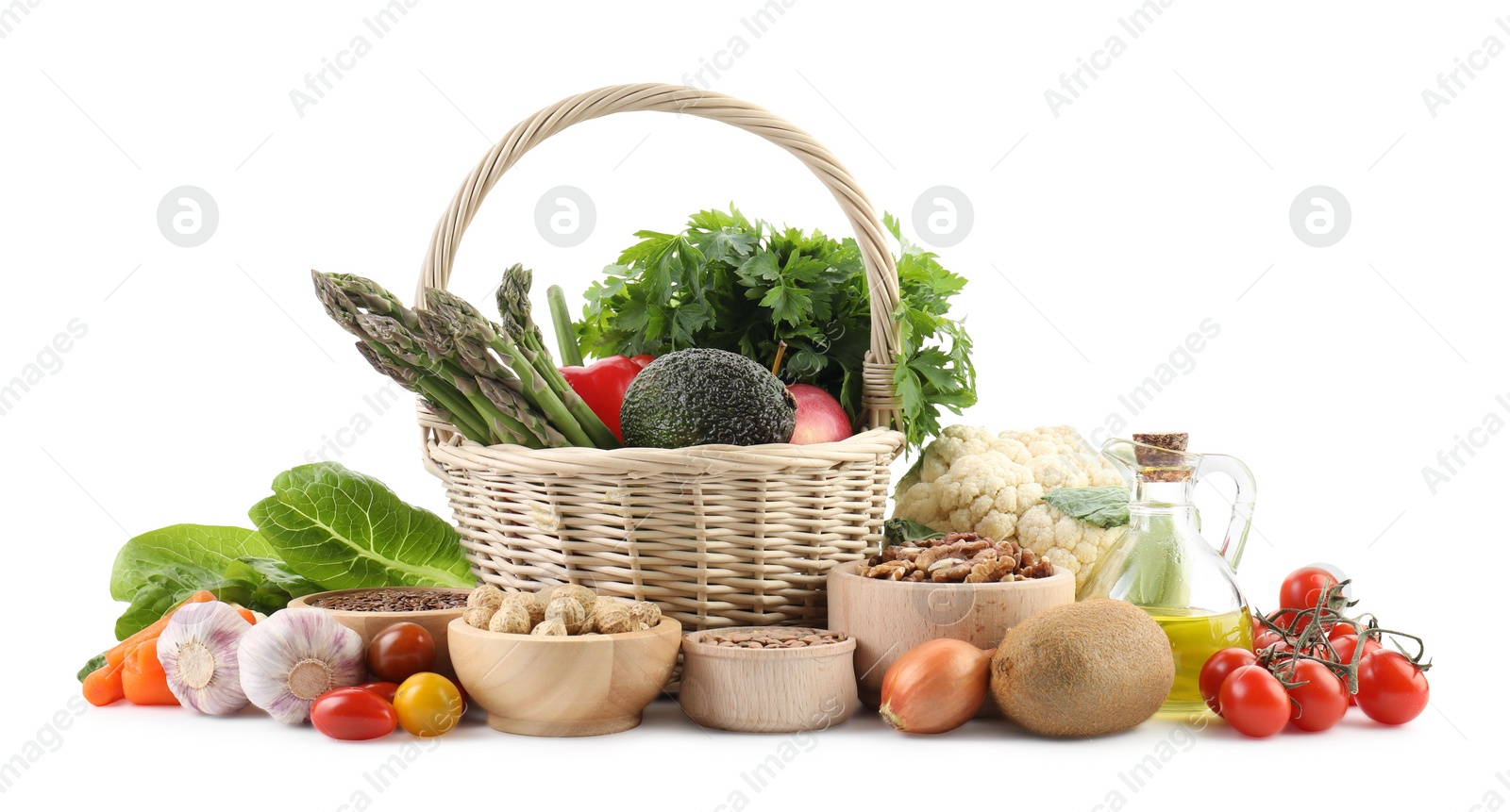 Photo of Healthy food. Basket with different fresh products isolated on white