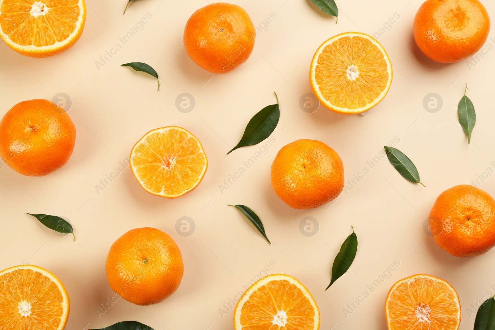 Photo of Flat lay composition with tangerines on beige background