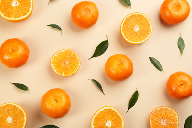 Flat lay composition with tangerines on beige background