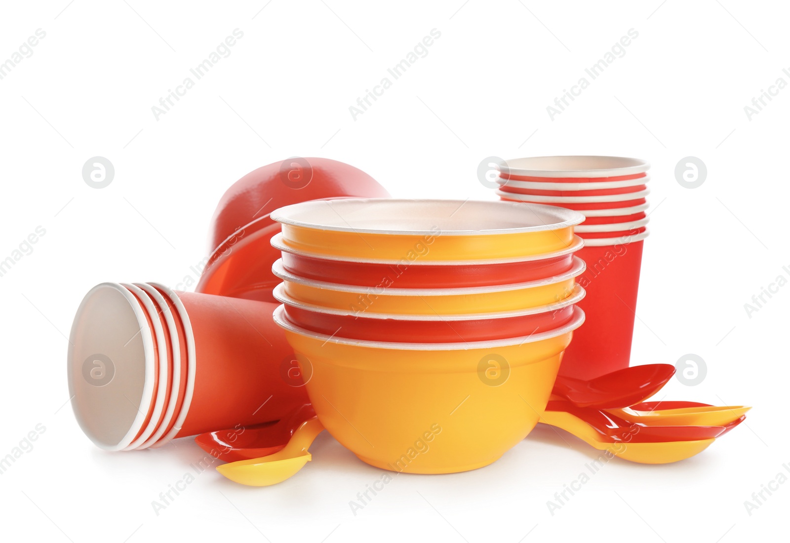 Photo of New plastic dishware on white background. Table setting