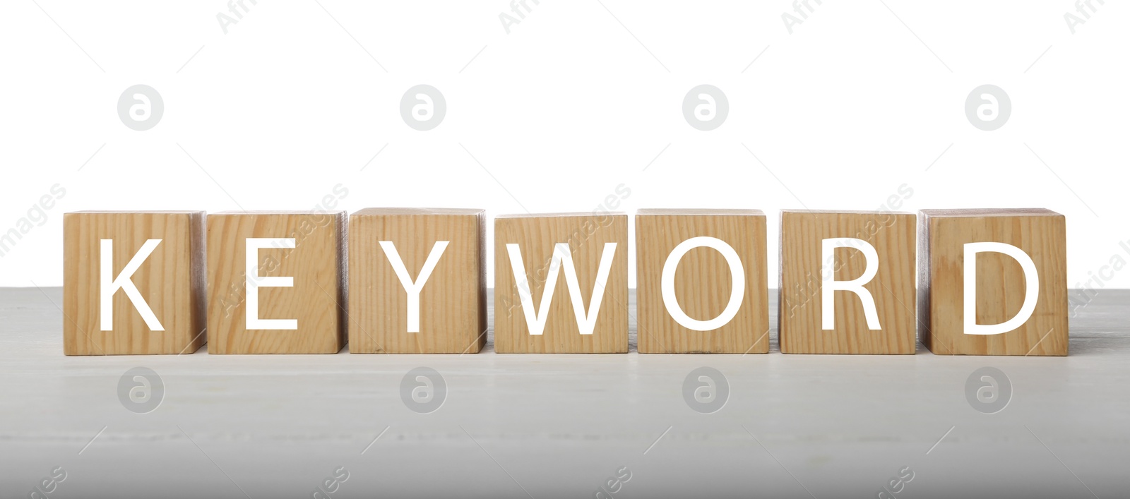 Photo of Word KEYWORD made of wooden cubes on white background