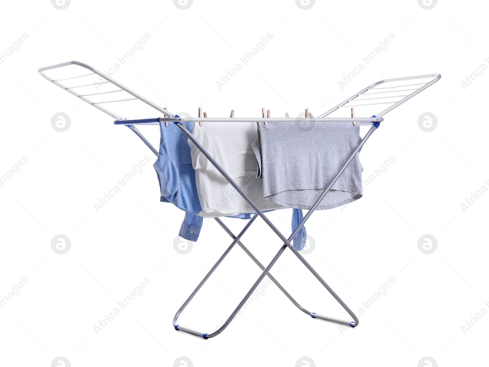 Photo of Clean laundry hanging on drying rack against white background