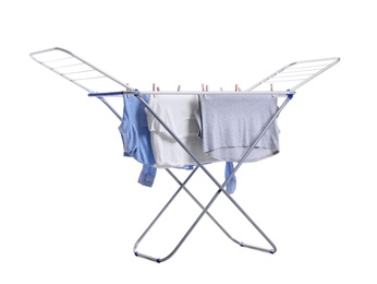 Photo of Clean laundry hanging on drying rack against white background