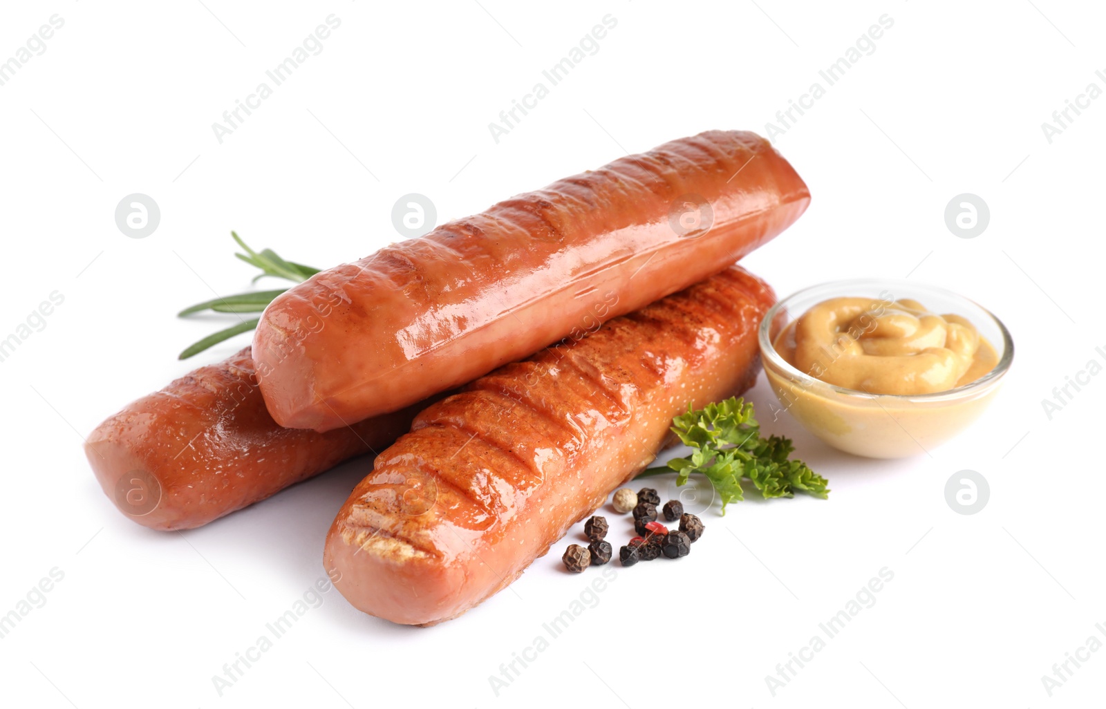 Photo of Delicious grilled sausages and sauce on white background. Barbecue food