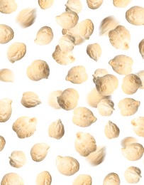 Image of Many chickpeas falling on white background. Vegan diet  