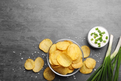 Photo of Flat lay composition with delicious crispy potato chips on table, space for text