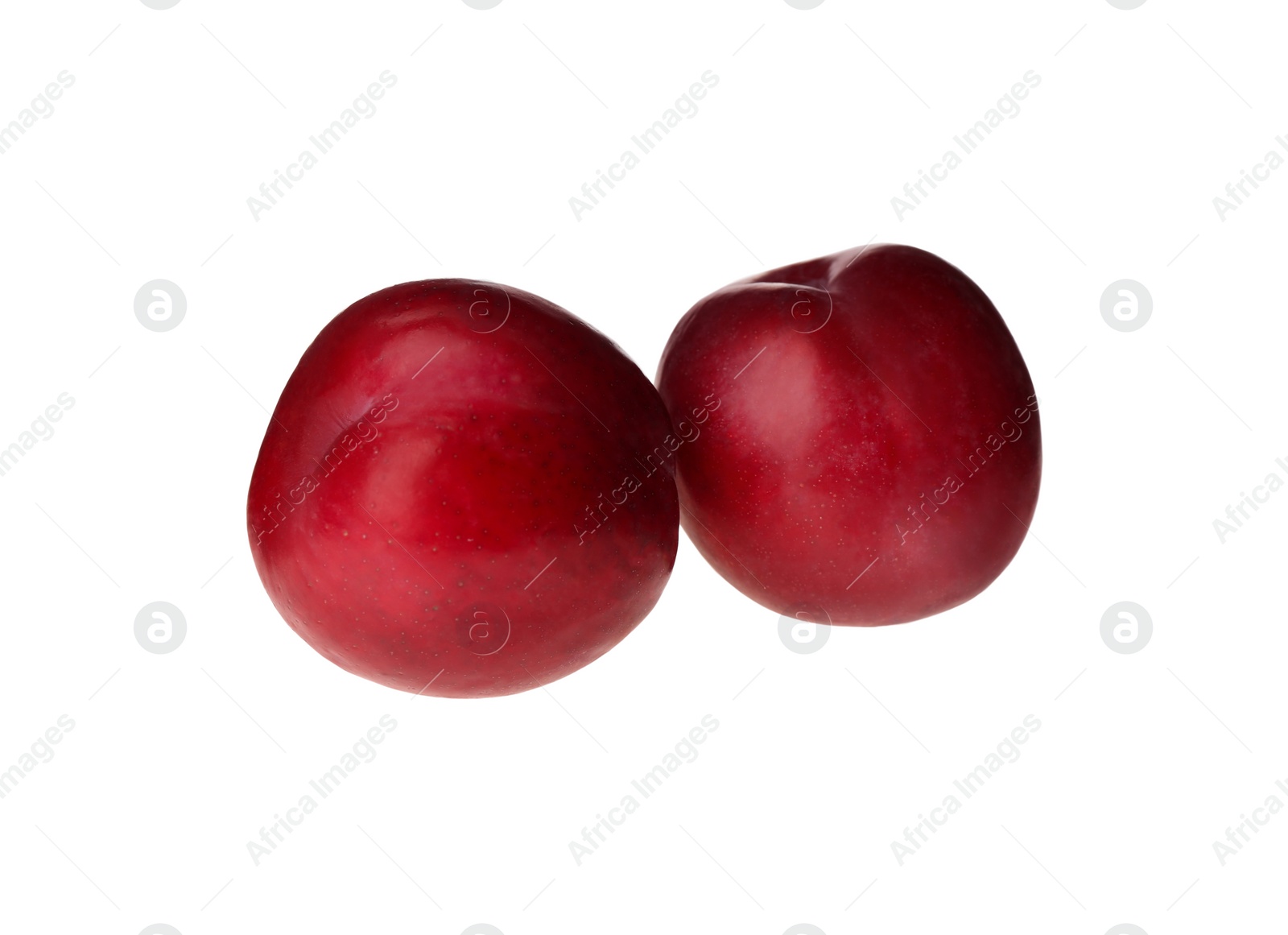 Photo of Delicious fresh ripe plums isolated on white