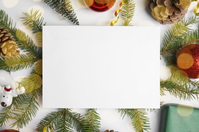 Photo of Beautiful Christmas decor and blank card on white background, flat lay