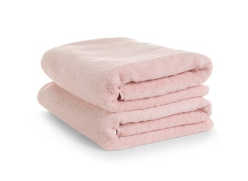 Folded clean soft towels on white background