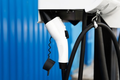 Electric vehicle charging station outdoors, closeup view