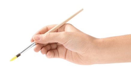 Photo of Young woman holding brush with color paint on white background, closeup