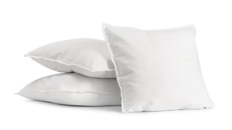 Photo of Many new soft pillows isolated on white