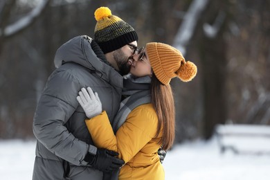 Beautiful happy couple outdoors on winter day