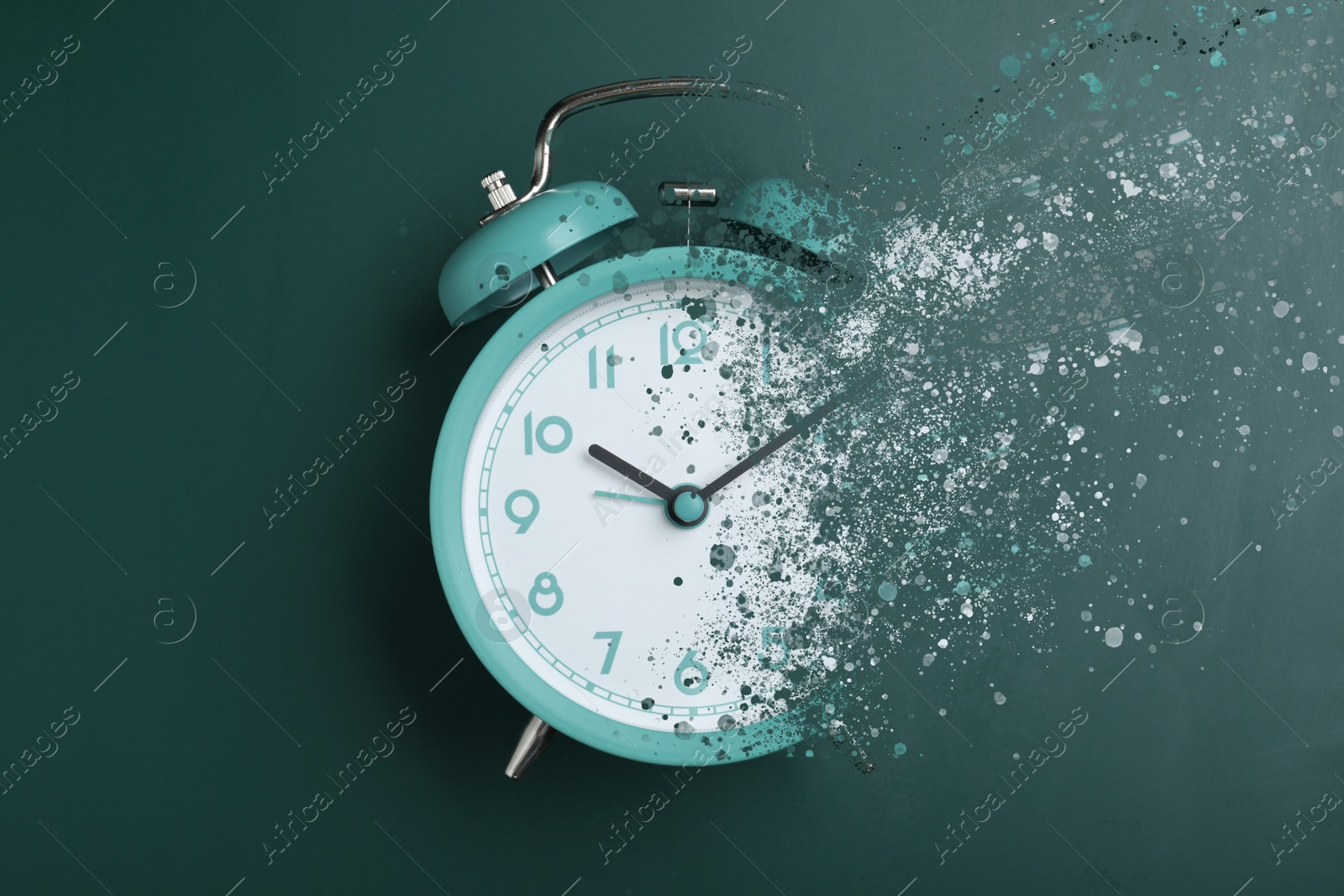 Image of Time is running out. Turquoise alarm clock vanishing on green background, top view
