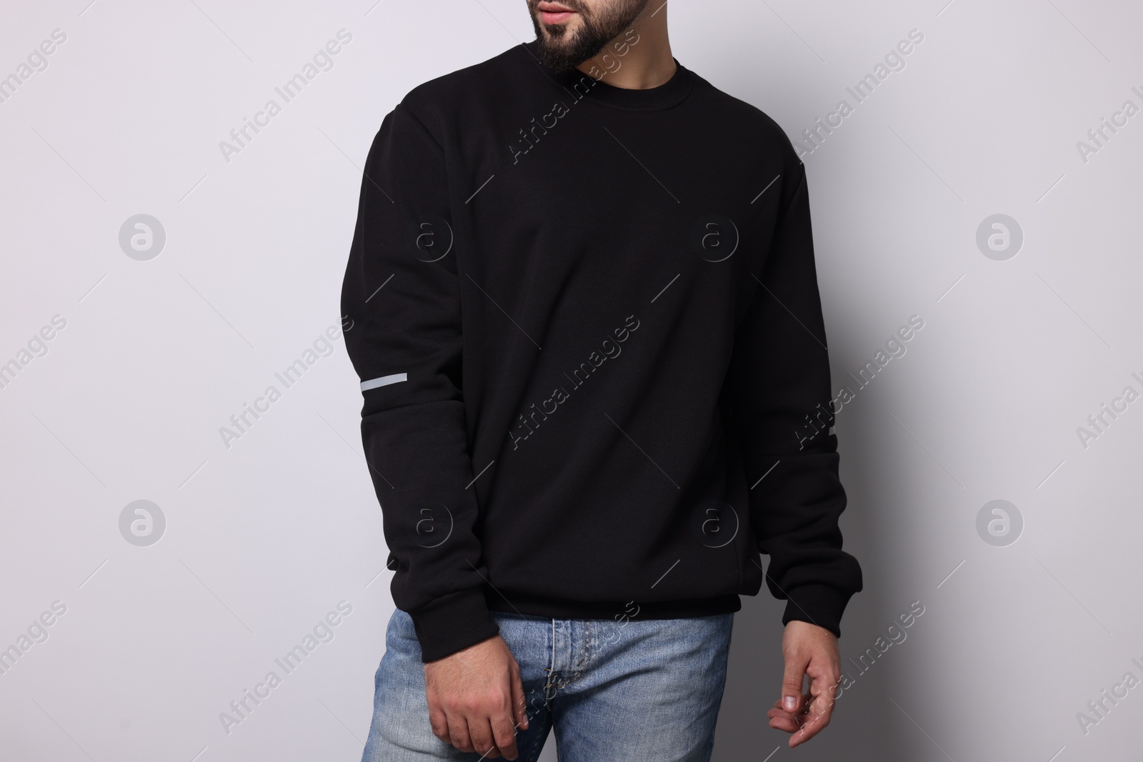 Photo of Man in stylish sweater on white background, closeup