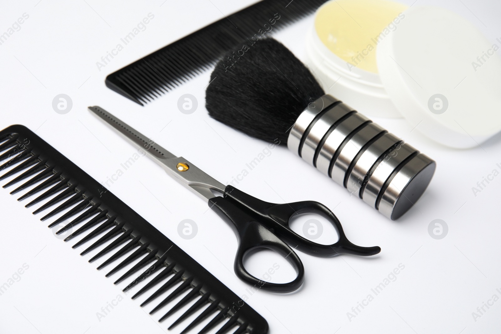 Photo of Professional hairstyling tools on white background, closeup