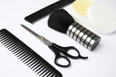 Photo of Professional hairstyling tools on white background, closeup