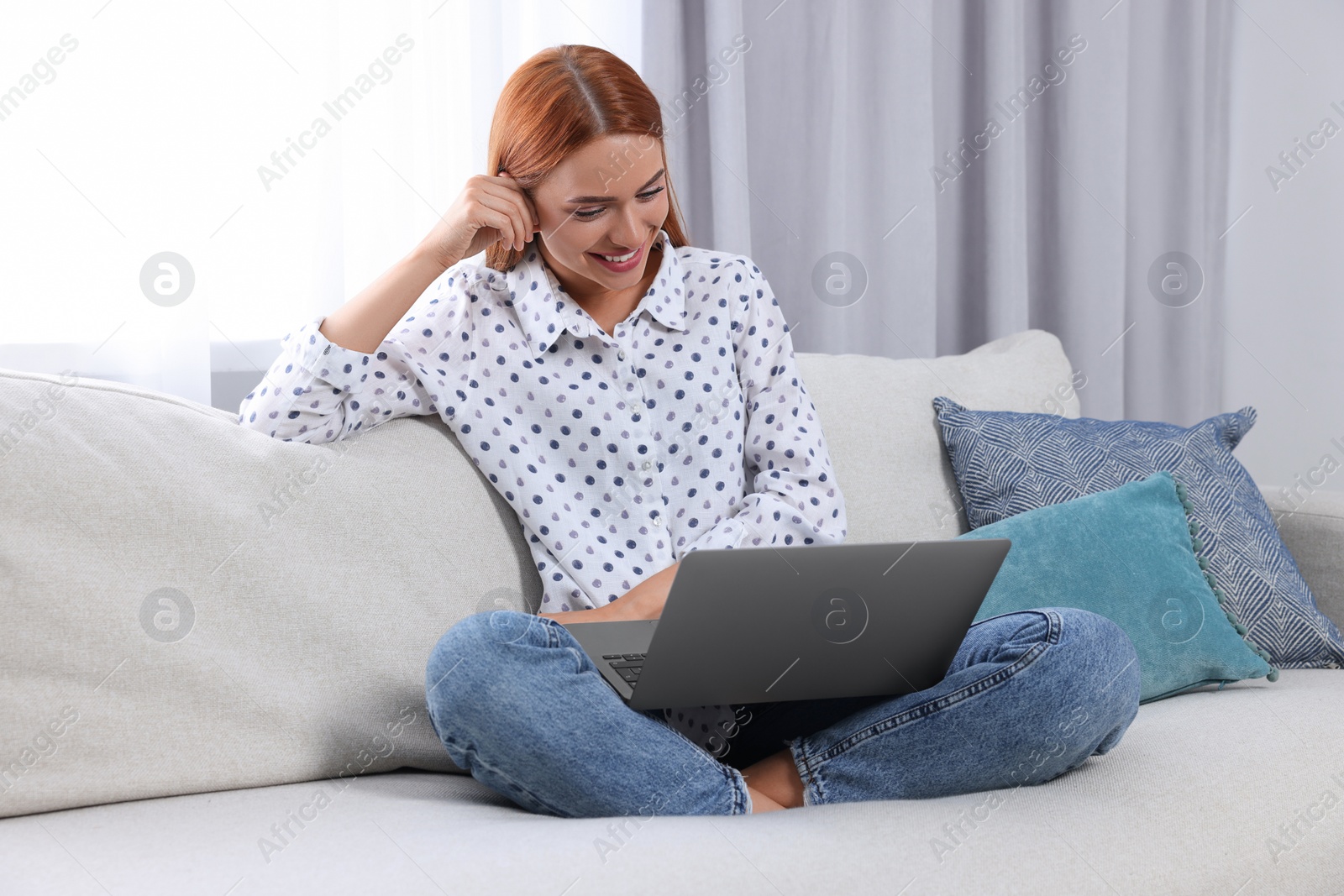 Photo of Woman having video chat via laptop at home