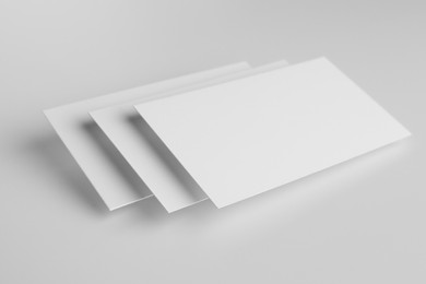 Photo of Blank business cards on white background. Mockup for design