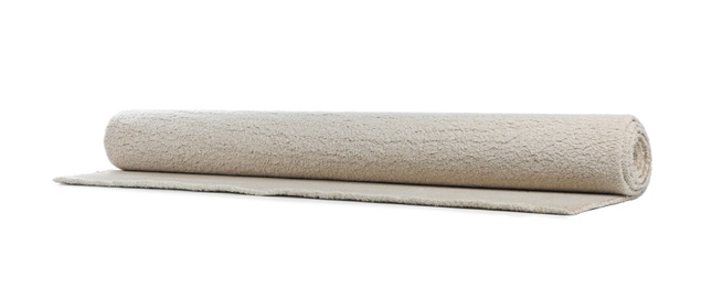 Photo of Rolled soft carpet on white background. Interior element