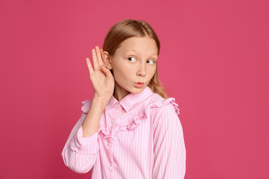 Photo of Portrait of emotional preteen girl on pink background