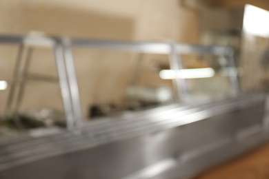Photo of Blurred view of serving line with food in school canteen