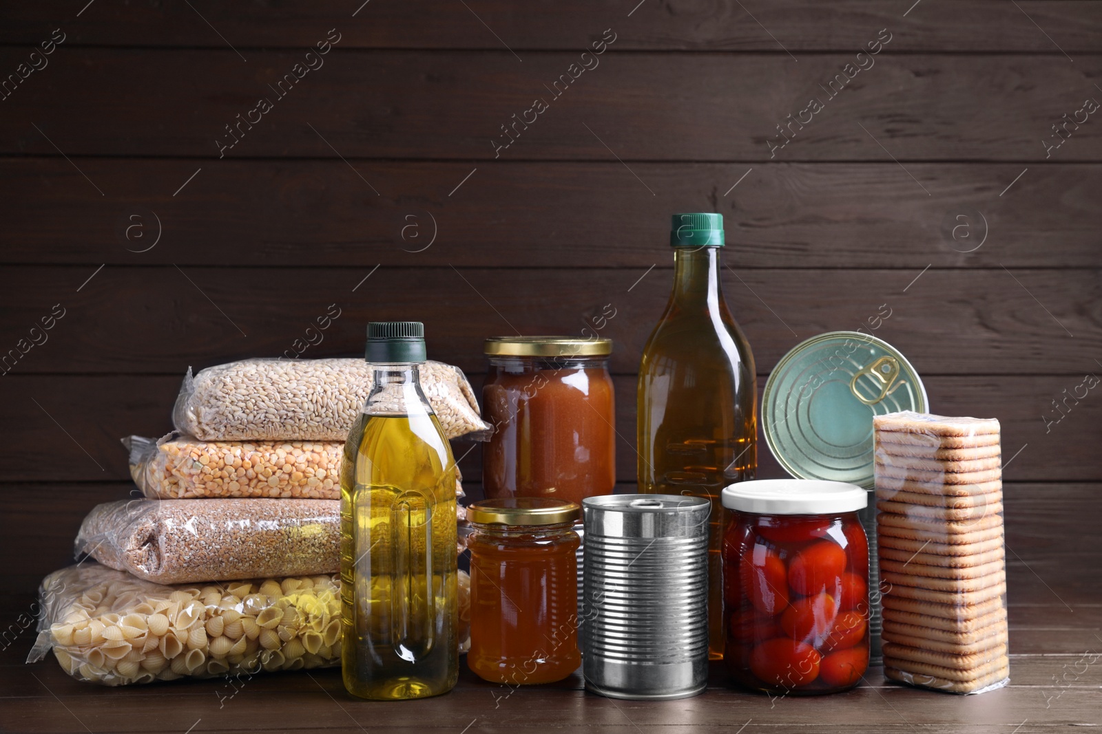 Photo of Different products on wooden table. Food donation