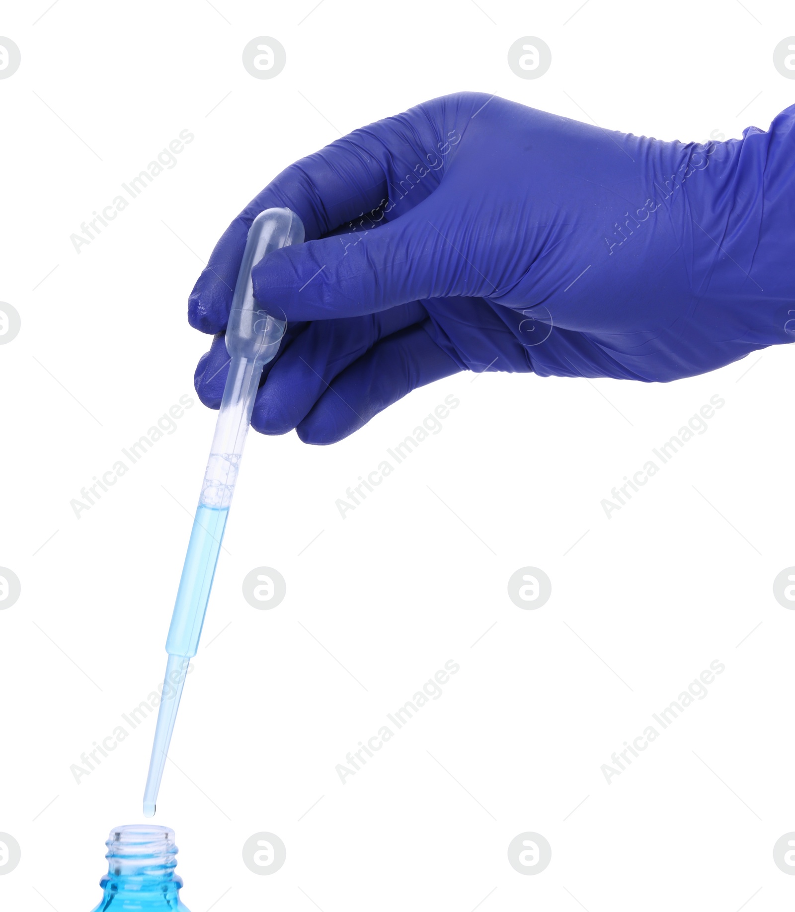 Photo of Scientist dripping liquid from pipette into bottle on white background, closeup