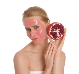 Photo of Young woman with pomegranate face mask and fresh fruit on white background